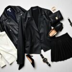 Flick International Stylish flat lay of black and white fashion items including a leather jacket, blouse, and mini skirt