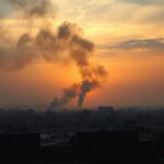 Flick International Aerial view of a war-torn landscape in Gaza with rubble and smoke