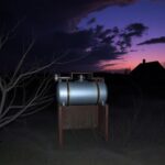 Flick International A dark, ominous landscape depicting an abandoned execution chamber in rural Louisiana at twilight.