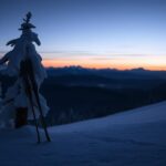 Flick International Snow-covered mountain slope with abandoned skis symbolizing a skiing passion