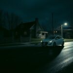 Flick International Dark streetscape in Moscow, Idaho with a white Hyundai Elantra parked during the night