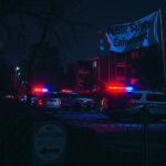 Flick International Nighttime view of a Houston apartment complex with police lights flashing