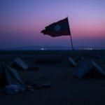 Flick International A deserted refugee camp at dusk with worn tents and scattered belongings