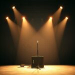 Flick International Dimly lit concert stage with empty microphone stand surrounded by soft spotlights
