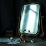 Flick International Dimly lit room with a vintage mirror and wilted flowers symbolizing regret and introspection