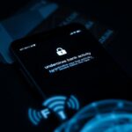 Flick International Close-up view of a smartphone displaying a suspicious SMS alert about unauthorized bank activity