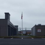 Flick International Exterior view of an ICE facility in Newark, New Jersey, under a gray sky