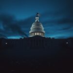 Flick International A serene twilight view of the U.S. Capitol building with broken glass on the steps, symbolizing events from the Capitol Riot.