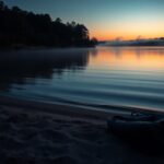 Flick International Serene view of Lake Lanier at twilight, featuring a pair of flip-flops and an inflatable kayak bag on the sandy shore