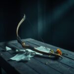 Flick International A broken archery bow on a weathered wooden table, symbolizing disappointment.