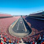 Flick International Aerial view of a packed Indianapolis Motor Speedway with vibrant banners and racing cars