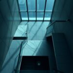 Flick International Dramatic high-angle view of a modern luxury high-rise stairwell