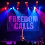 Flick International Moody concert stage illuminated by colorful spotlights with electric guitar and microphone stand