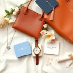 Flick International Luxurious graduation gifts arranged elegantly on a soft surface