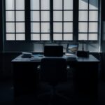 Flick International A somber office environment depicting an empty chair and scattered paperwork, symbolizing conflict between personal beliefs and workplace expectations