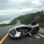 Flick International A mangled car on its side at Laguna Beach after a tragic driving accident