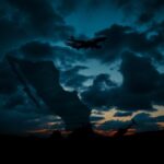 Flick International Silhouette of Air Force One in twilight sky representing national security
