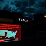 Flick International Dark urban landscape featuring a Tesla dealership with shattered windows and warning messages about data breaches.