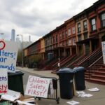 Flick International Protesters holding handmade signs against a homeless shelter in Sheepshead Bay, Brooklyn