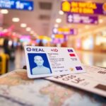 Flick International Close-up of a REAL ID card on an airport boarding pass with travelers in the background