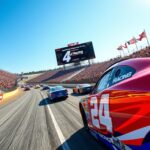 Flick International Vibrant NASCAR race scene featuring colorful race cars and enthusiastic fans at the circuit.