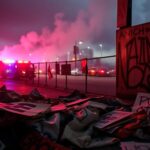 Flick International Aftermath of protests in Los Angeles with discarded signs and graffiti