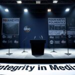 Flick International Empty press conference stage with a glossy black podium and microphones, highlighting media ethics