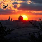 Flick International Dramatic skyline of Jerusalem at sunset with the Dome of the Rock and U.S. Embassy silhouette