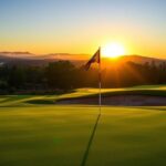 Flick International A serene golf course at dawn with dew glistening on the grass