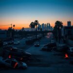 Flick International A stark urban landscape in Los Angeles showing burnt-out cars and protest remnants