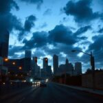 Flick International Dusk view of Downtown Los Angeles skyline with police barricades and a National Guard truck