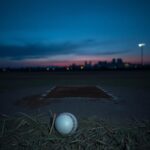 Flick International Somber baseball field at twilight reflecting on past glories