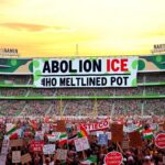 Flick International Large, colorful anti-ICE banner displayed at an Austin FC soccer match