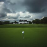 Flick International A lush, manicured golf course at Oakmont Country Club under dark storm clouds