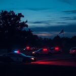 Flick International A quiet Minnesota town at twilight with flashing police lights signifying law enforcement presence