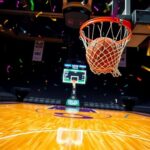 Flick International Action shot of a basketball soaring towards the hoop during a vibrant game
