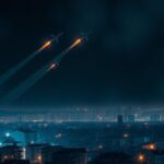 Flick International Aerial view of the illuminated Israeli skyline at night with missile interception systems