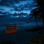 Flick International Twilight beach scene in the Dominican Republic highlighting empty lounge chairs and a deserted boardwalk