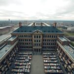Flick International Aerial view of a historic Chicago school building with empty classrooms and neglected facilities