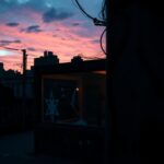 Flick International Urban landscape at dusk depicting antisemitism with graffiti and a shattered storefront window