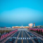 Flick International A wide view of Ronald Reagan National Airport with aircraft grounded, showcasing a festive military parade atmosphere.