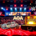 Flick International Championship belts and briefcase in a vibrant wrestling scene