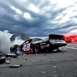 Flick International NASCAR No. 48 car wrecked against the wall at Michigan International Speedway