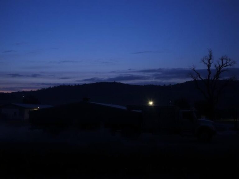 Flick International Twilight view of Fort Stewart military base with silhouetted building and rolling hills